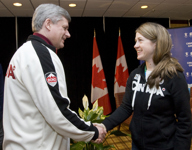 [Prime Minister Stephen Harper and Gary Lunn visit with 5-time gold medallist Lauren Woolstencroft at the Paralympic 2010 Games in Whistler, British Columbia] 21 March 2010