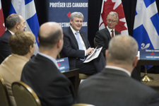 [Prime Minister Stephen Harper, joined by Steven Blaney, Denis Lebel and Senator Pierre-Hugues Boisvenu, discusses the Government of Canada's ongoing commitment to protecting Canadian families during a roundtable discussion with victims of crime in Victoriaville, Quebec] 12 February 2015