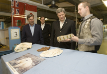 [Prime Minister Stephen Harper looks at the paw mould of a large polar bear during his visit to Churchill, Manitoba] 5 October 2007