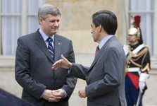 [French Prime Minister François Fillon and Canada's Prime Minister Stephen Harper chat after a press conference in the courtyard of the Hotel Matignon in Paris, France] 5 June 2007