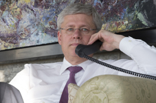 [Prime Minister Stephen Harper speaks with Quebec Premier Philippe Couillard after a gunman entered Parliament Hill] 22 October 2014