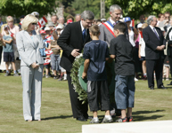[Prime Minister Stephen Harper and his wife Laureen Harper visit a military cemetery in Bralin, France] 18 July 2006