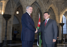 [King Abdullah of Jordan and Prime Minister Stephen Harper say goodbye on Parliament Hill in Ottawa] 13 July 2007