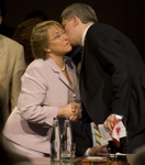 [Prime Minister Stephen Harper greets Michelle Bachelet, the President of Chile, with a kiss prior to the opening plenary session at the Summit of the Americas in Port of Spain, Trinidad and Tobago] 18 April 2009