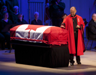 [Reverend Hawkes places a hand on the casket at the state funeral of Jack Layton, leader of Her Majesty's Loyal Opposition in Toronto, Ontario] 27 August 2011
