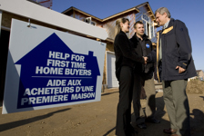 [Stephen Harper chats with first-time home owners Stephanie Roberts and Brad Shildroth as he tours a housing project in Kitchener, Ontario] 16 September 2008