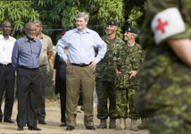 [Prime Minister Stephen Harper and Haitian President René Préval visit with some Canadian Forces troops that are part of the relief effort in Port-au-Prince, Haiti] 15 February 2010
