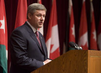 [Prime Minister Stephen Harper addresses King Abdullah of Jordan and other guests gathered in the Cadieux Auditorium in the Lester B. Pearson building for speeches in Ottawa] 13 July 2007