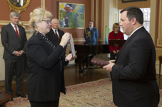 [Prime Minister Stephen Harper and David Johnston, Governor General of Canada, look on as Jason Kenney is sworn in as Minister of National Defence and Minister for Multiculturalism at a ceremony at Rideau Hall, Ottawa] 9 February 2015