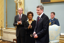 [Jean-Daniel Lafond and Governor General Michaëlle Jean applaud Stephen Harper after he is sworn in as the 22nd Prime Minister of Canada at Rideau Hall in Ottawa, Ontario] 6 February 2006