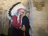 [Prime Minister Stephen Harper and Assembly of First Nations Chief Phil Fontaine walk to the House of Commons for the official apology for more than a century of abuse and cultural loss involving Indian residential schools on Parliament Hill in Ottawa] 11 June 2008