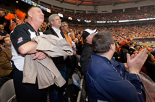 [Prime Minister Stephen Harper sits with Senator David Braley at the 99th Grey Cup final in Vancouver, British Columbia] 27 November 2011