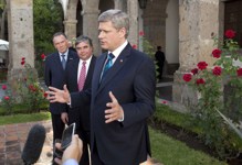 [Prime Minister Stephen Harper holds a news conference with Peter Kent and Peter Van Loan following his meeting with Mexican President Felipe Calderón at the start of the North American Leaders Summit in Guadalajara, Mexico] 9 August 2009