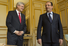 [Prime Minister Stephen Harper and French President François Hollande chat following a working luncheon at the Palais de l'Élysée in Paris, France] 14 June 2013