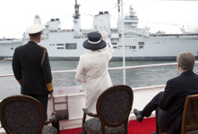 [Her Majesty Queen Elizabeth II waves from the HMCS St. John's during a fleet review of 28 Canadian and foreign warships at anchor in Bedford Basin and Halifax Harbor] 29 June 2010