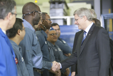 [Prime Minister Stephen Harper speaks to the workers at Héroux-Devtek who manufacture parts for the F-35 fighter jet while in Longueuil, Quebec] 14 January 2011