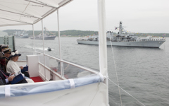 [Her Majesty Queen Elizabeth II looks on from the HMCS St. John's during a fleet review of 28 Canadian and foreign warships at anchor in Bedford Basin and Halifax Harbor] 29 June 2010
