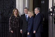 [From left, Sarah Brown, Prime Minister Stephen Harper, his wife Laureen Harper and British Prime Minister Gordon Brown stand outside 10 Number Downing Street in London, prior to the G20 working dinner] 1 April 2009