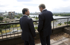 [King Abdullah of Jordan and Prime Minister Stephen Harper walk on the balcony of the Lester B. Pearson building following their speeches in Ottawa] 13 July 2007