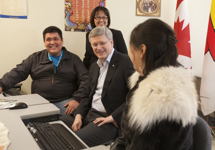 [Prime Minister Stephen Harper and Leona Aglukkaq visit with Nunavut Arctic College students Jay Atuat Shouldice and Sileema Angojuakt in Iqaluit, Nunavut] 23 February 2012