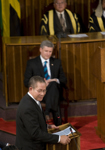 [Prime Minister Stephen Harper listens as Prime Minister Bruce Golding of Jamaica addresses a joint session of Jamaica's Houses of Parliament in Kingston, Jamaica] 20 April 2009