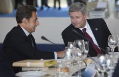 [French President Nicolas Sarkozy visits with Prime Minister Stephen Harper during a working lunch at the G8 Summit in L'Aquila, Italy] 8 July 2009