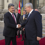 [Prime Minister Stephen Harper and his wife Laureen Harper are greeted by Petro Poroshenko, President of Ukraine, and Mrs. Maryna Poroshenko upon their arrival at the Presidential Administration Building during their bilateral visit to Ukraine] 6 June 2015