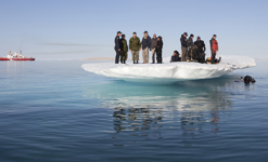 [Prime Minister Stephen Harper chats with General Walter Natynczyk, Chief of the Defence Staff, and other staff involved in the planning and execution of Operation NANOOK 10 in Resolute, Nunavut] 25 August 2010