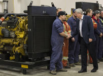 [Prime Minister Stephen Harper, joined by the Honourable Kerry-Lynne Findlay, tours the British Columbia Institute of Technology Annacis Campus with Steve Perry and Gary Shore, in Delta, British Columbia] 8 January 2015