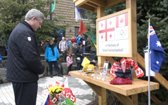 [Prime Minister Stephen Harper pays his respects at a memorial to Georgian luger Nodar Kumaritashvili in Whistler, British Columbia] 21 March 2010