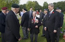 [Prime Minister Stephen Harper meets Canadian tourists at the Canadian military cemetery in Beny-sur-Mer, France] 6 June 2009