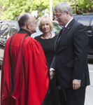 [Prime Minister Stephen Harper and his wife Laureen Harper are greeted by Reverend Brent Hawkes at the state funeral of Jack Layton, leader of Her Majesty's Loyal Opposition in Toronto, Ontario] 27 August 2011