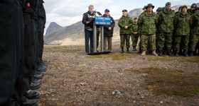 [Prime Minister Stephen Harper, joined by Rob Nicholson, Minister of National Defence, and Brigadier-General Greg Loos, addresses members of the Canadian Armed Forces in York Sound, Nunavut after participating in Operation NANOOK during the ninth annual tour of Canada's northern territories] 26 August 2014