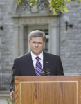 [Prime Minister Stephen Harper holds a press conference on the lawn of 24 Sussex Drive following a cabinet swearing-in ceremony at Rideau Hall in Ottawa] 14 August 2007