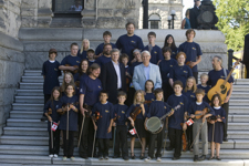 [British Columbia Premier Gordon Campbell and Prime Minister Stephen Harper have their photo taken with a group of young musicians following British Columbia's 150th Anniversary celebrations in Victoria] 4 August 2008