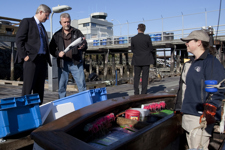 [Prime Minister Stephen Harper buys a salmon from Michael Derry on the Fisherman's Wharf in Victoria, British Columbia] 9 September 2010