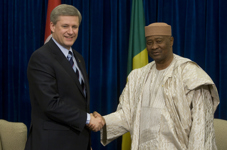 [Prime Minister Stephen Harper, left, shakes hand with Mali President Amadou Toumani Touré during a bilateral meeting as part of the Sommet de la Francophonie in Québec City] 18 October 2008