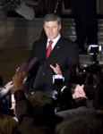 [Prime Minister Stephen Harper talks to the media following votes in favour of the government's motion to call Québécois' a nation within a nation during votes on Parliament Hill in Ottawa] 27 November 2006