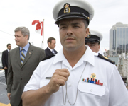 [Prime Minister Stephen Harper walks by Petty Officer 2nd Class (PO2) Paul Smith aboard the HMCS Halifax in Halifax, Nova Scotia] 5 July 2007