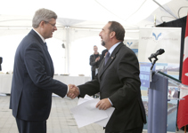 [Minister of State Denis Lebel introduces Prime Minister Stephen Harper at an announcement at the port at Sept-Îles, Quebec] 13 September 2010