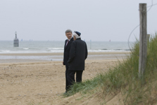 [D-Day veteran Sam Garnet, 85, of Montréal and Prime Minister Stephen Harper chat as they walk on Juno Beach following the 65th D-Day ceremony in Courseulles-sur-Mer, France] 6 June 2009