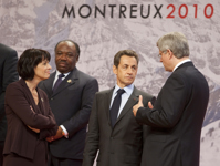 [Prime Minister Stephen Harper chats with French President Nicolas Sarkozy and Swiss President Doris Leuthard during a family photograph at the Francophonie Summit in Montreux, Switzerland] 23 October 2010