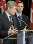 [Prime Minister Stephen Harper and Ontario Premier Dalton McGuinty answer questions during a press conference in Toronto, Ontario] 20 December 2008