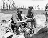 Peeling potatoes. June, 1916 June, 1916