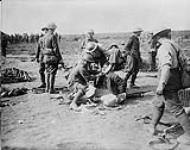 A Canadian dressing a comrades wound. September, 1916 Sept., 1916.