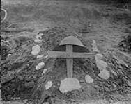 An unknown Canadian hero's grave behind firing line. October, 1916 Oct., 1916.