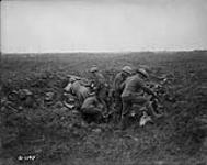 Canadian machine gunners dig themselves in in shell holes. Vimy Ridge. April, 1917 Apr., 1917