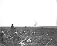 German shells bursting behind our dug-in troops. Vimy Ridge. April, 1917 Apr., 1917