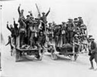 Happy Canadians who captured Vimy Ridge returning to rest billets on motor lorries. May, 1917 May, 1917.
