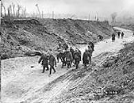 Carrying in wounded from capture of Arleux by Canadians. May, 1917 May, 1917.